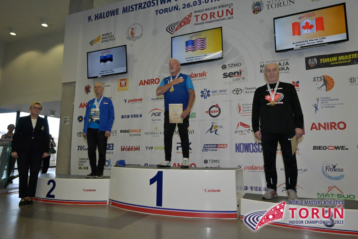 M80 weight throw medal ceremony: Henn Pärn, M80, EST, silver, Robert Cahners, M80, USA, gold, and Marek Glowacki, M80, CAN, bronze.