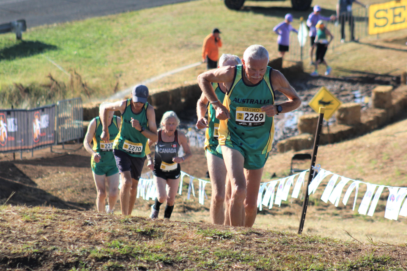 M70, Witold Krajewski leads other M70s, Roger Carter, Andrew Lee and Dennis Williams plus W70 Thelma Wright up the post mud hill during the 4k race.