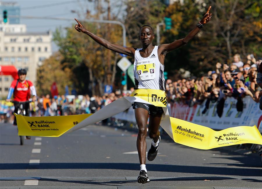 Hosea Kipkemboi of Kenya celebrates winning the Bucharest International Marathon race in Bucharest, capital of Romania, Oct. 13, 2019. (Photo by Cristian Cristel/Xinhua)